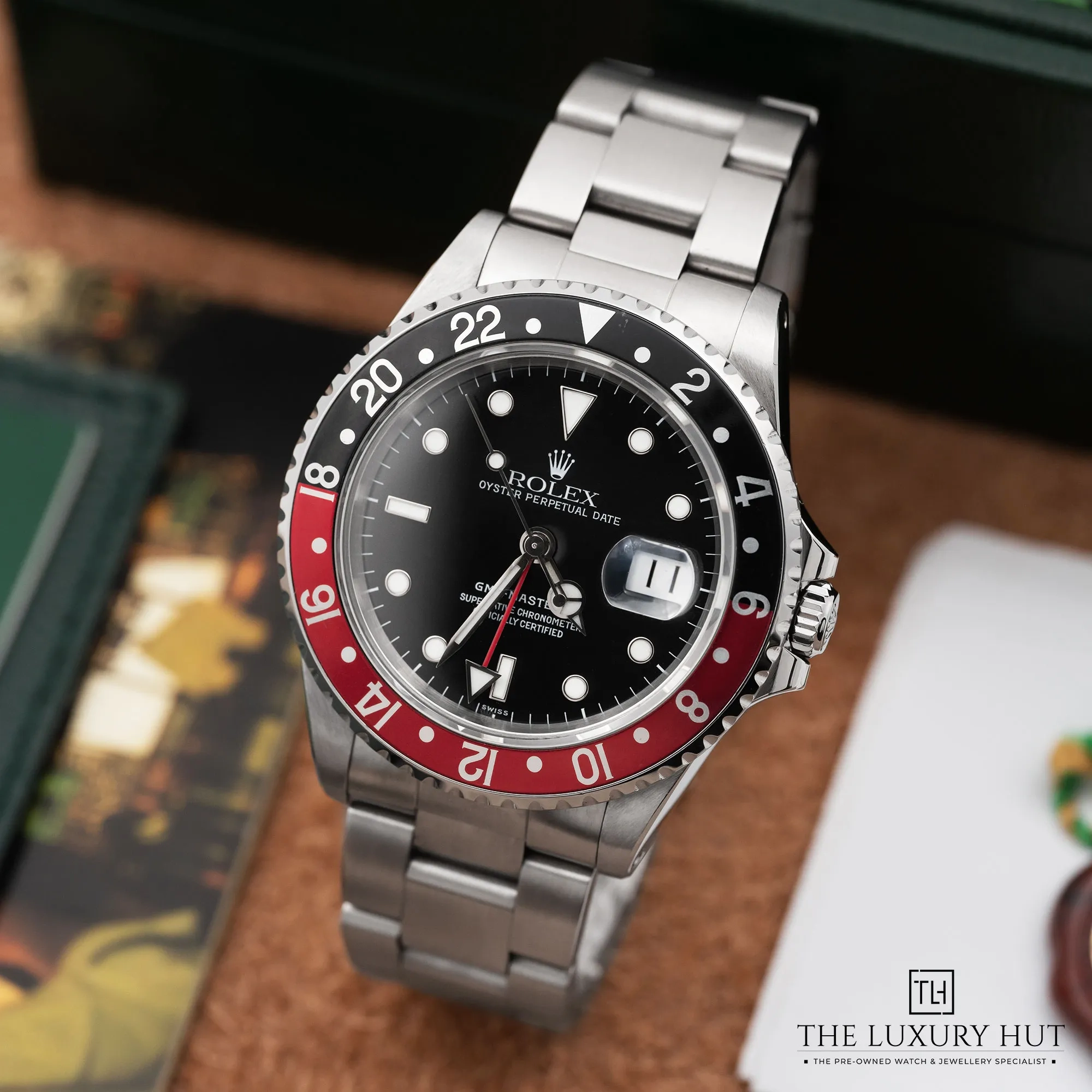 0ae705ef-2685-4448-98e4-6fee7ad3feceRolex_GMT-Master_II_Coke_40mm_Black_52408-b.webp