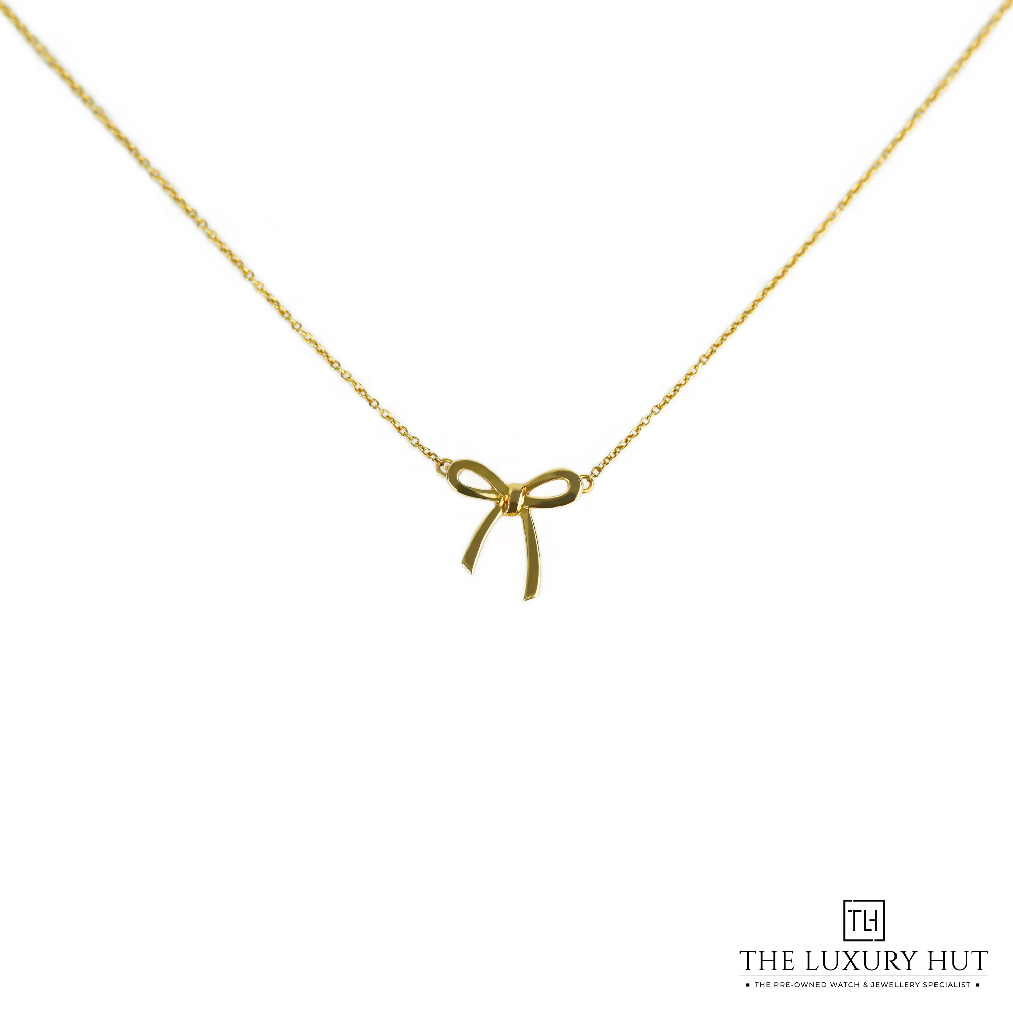 2024/11/Tiffany_Yellow_Gold_Ribbon_Pendant_LB398-a.jpg