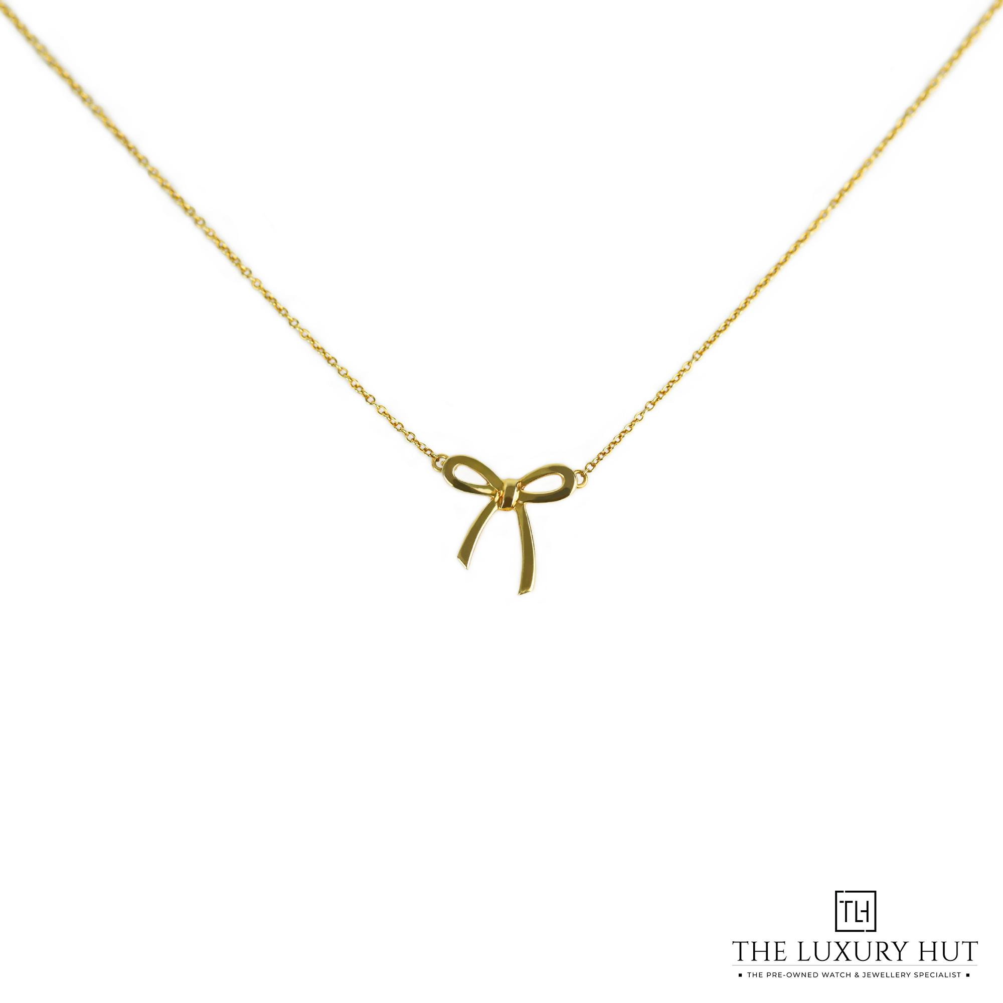 2024/11/Tiffany_Yellow_Gold_Ribbon_Pendant_LB398-a.jpg