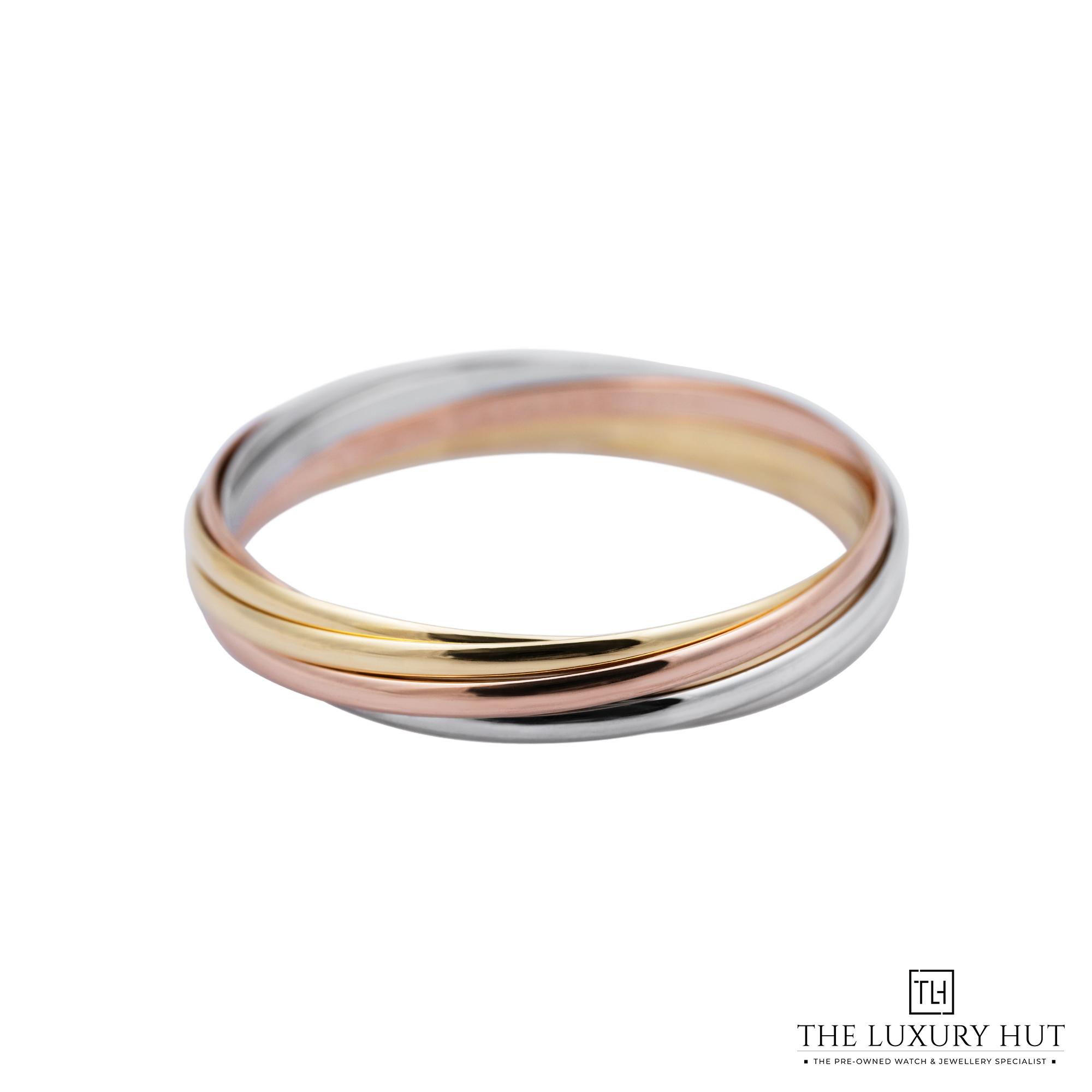 2025/10/6926ffed-342e-4f79-b966-f98c257b2401Cartier_Trinity_Bangle_18ct_Gold_7_Interlocking_Bands_52304-a.jpg