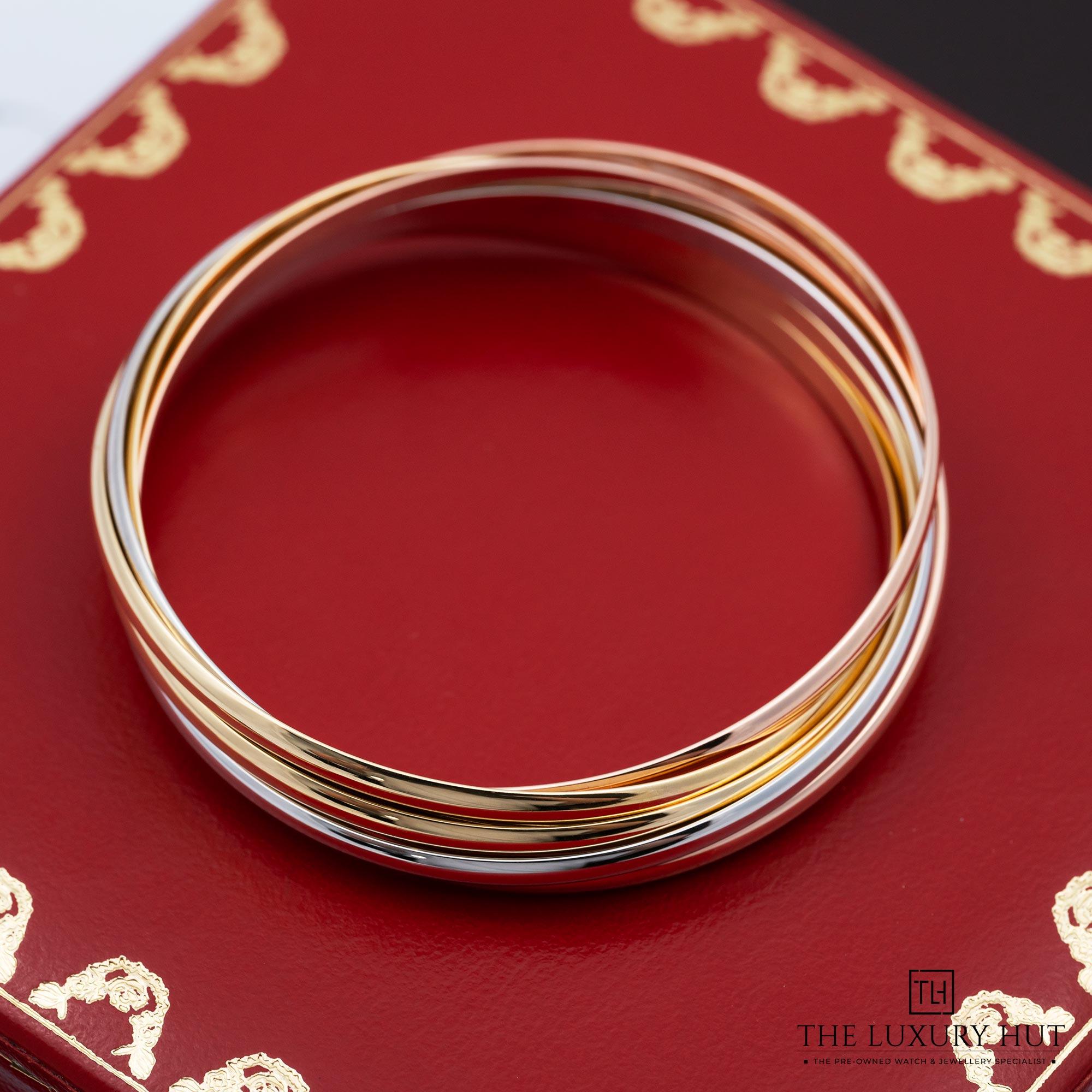 2025/10/9f134fb6-38b6-459d-97e5-1b094438da0aCartier_Trinity_Bangle_18ct_Gold_7_Interlocking_Bands_52304-c.jpg