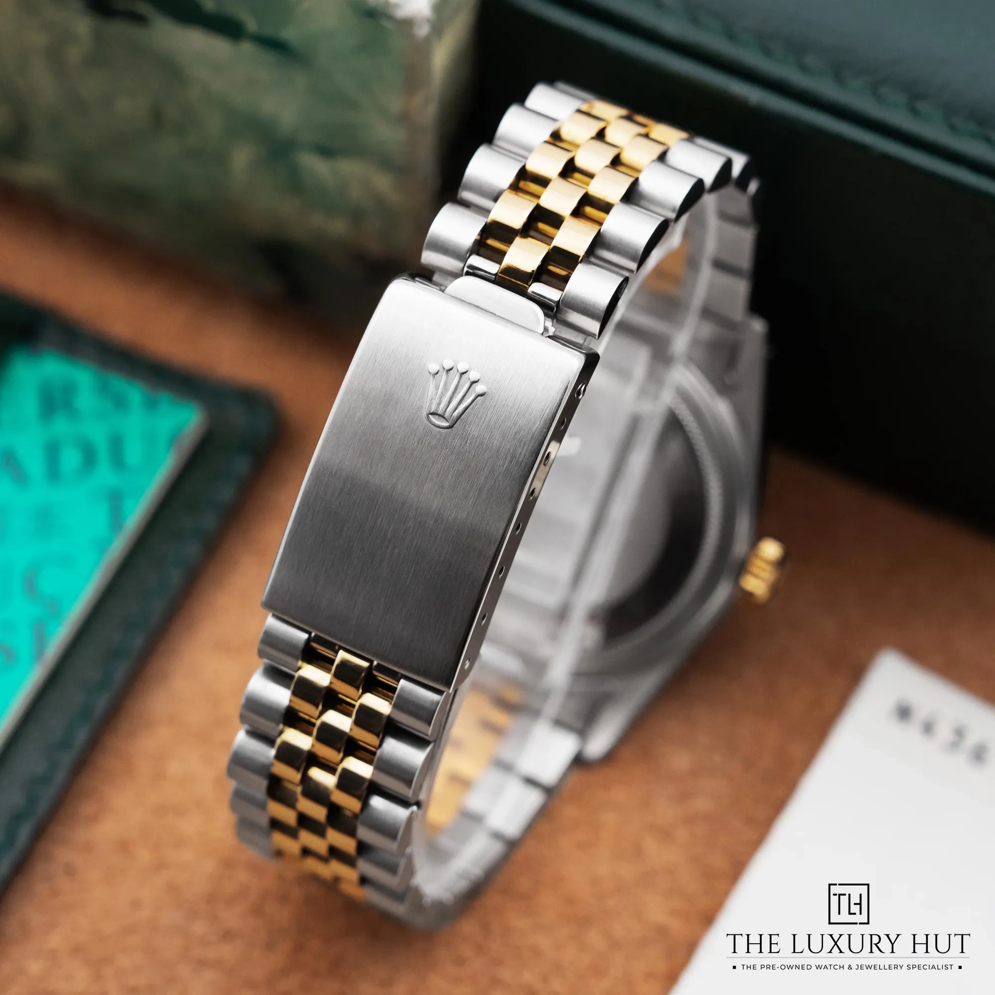 2026/02/0cd60fba-0827-4155-8e37-f8dedd772010Rolex_Datejust_Steel_Gold_36_Black_Baton_Dial_52558-d.jpg.webp