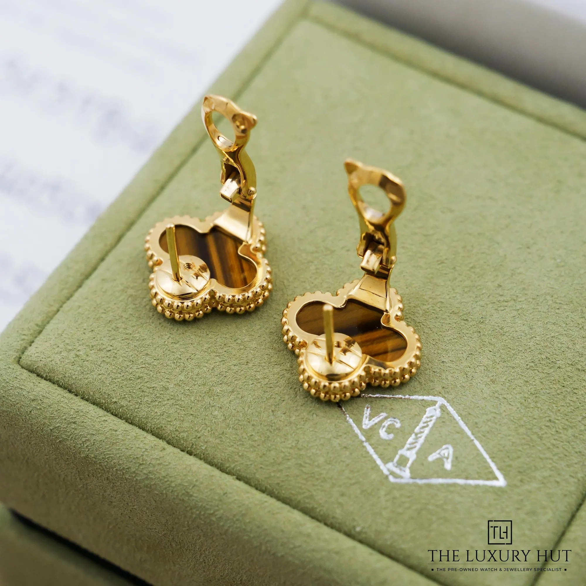 2026/09/5402fee7-54b2-472f-9f34-b969301b0443Van_Cleef_&_Arpels_Yellow_Gold_Tiger_Ey_Ear_Rings_53393-d.jpg.webp
