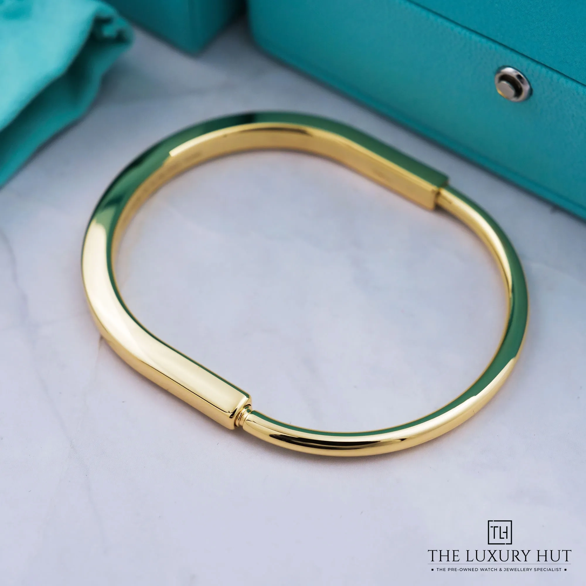 2026 10 c881b890 b21e 4f20 983b dda5944d76b4Tiffany Yellow Gold Lock Bangle 53484 b jpg webp