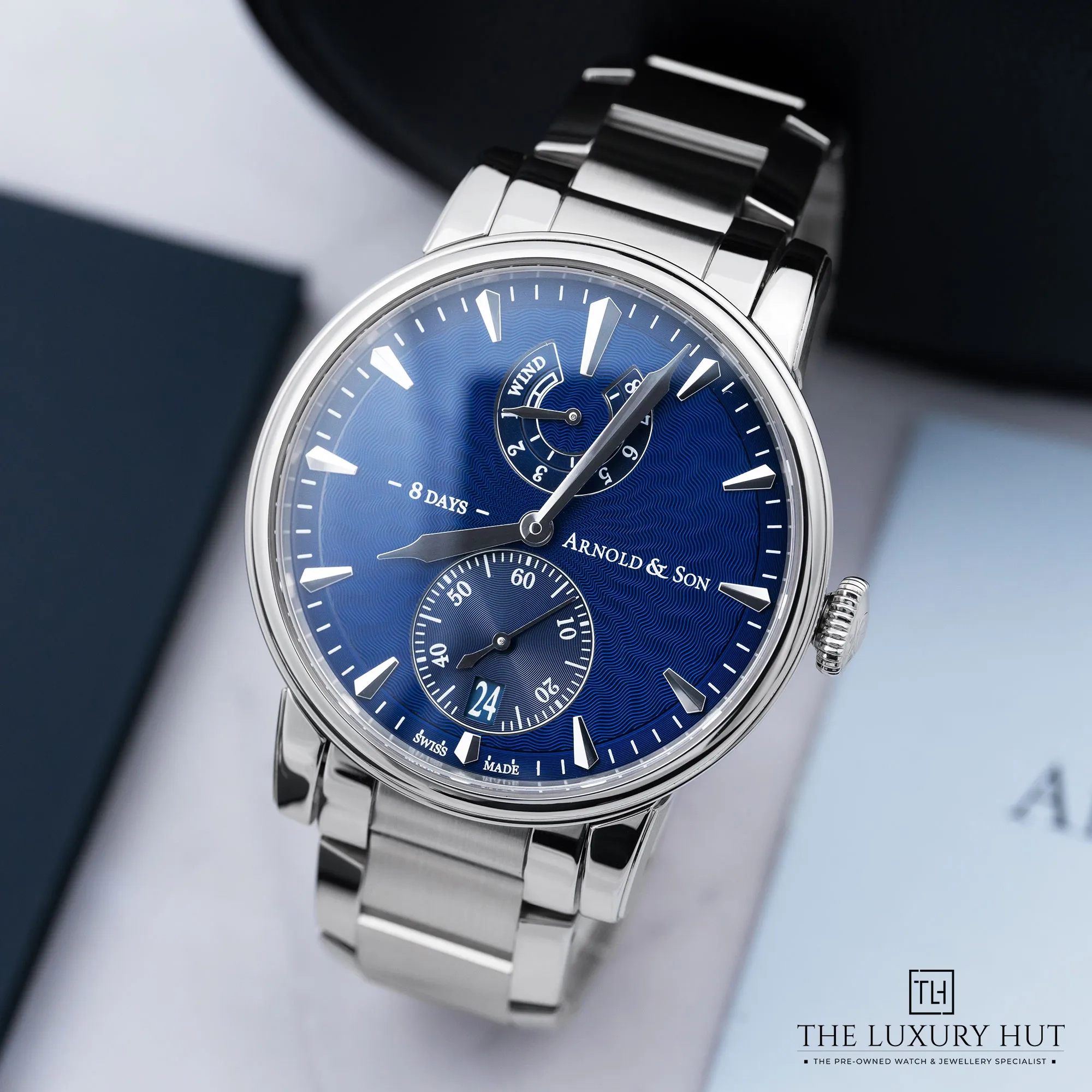 a1503bf2-ac57-45f3-9e68-84eb9782484dArnold_Son_Eight-Day_Steel_43mm_Blue_Guilloche_LB753-b.webp